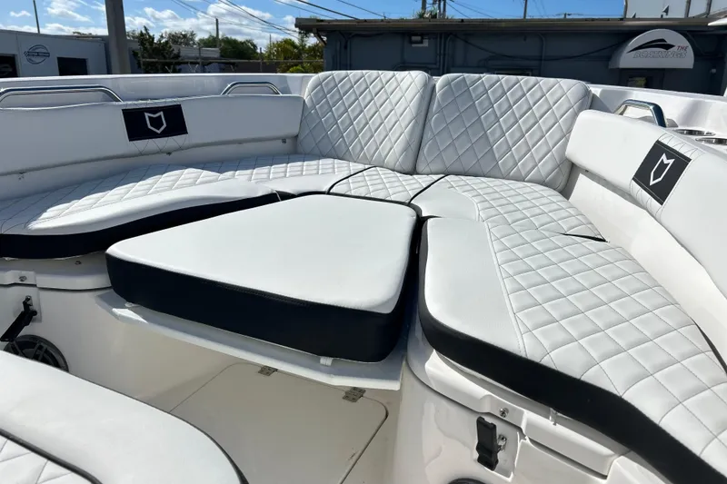 Slide: The Image of 2026 Sea Fox 228 Commander boat with luxurious white quilted seating. - 16