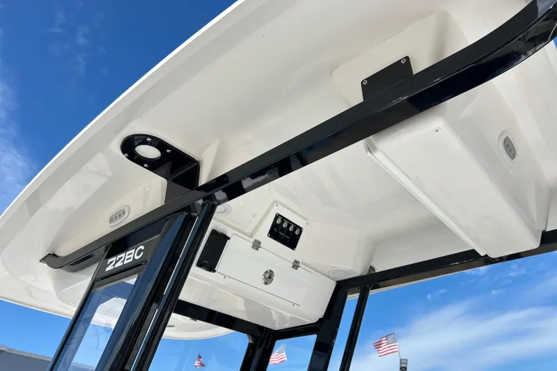 Slide: The Image of 2026 Sea Fox 228 Commander boat canopy with clear blue sky background. - 19
