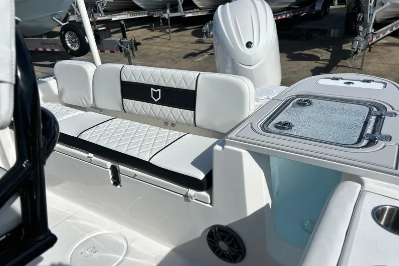 Slide: The Image of 2026 Sea Fox 228 Commander boat interior with white seating and storage compartments. - 22