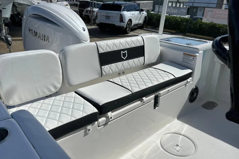 Slide: The Image of 2026 Sea Fox 228 Commander boat interior with cushioned seating and Yamaha engine. - 23