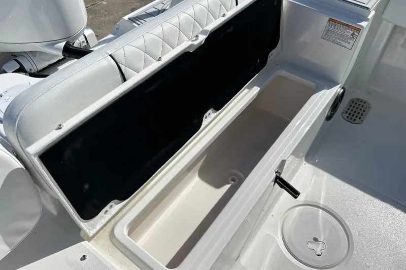 Slide: The Image of 2026 Sea Fox 228 Commander boat storage compartment with open lid, showcasing interior space. - 25