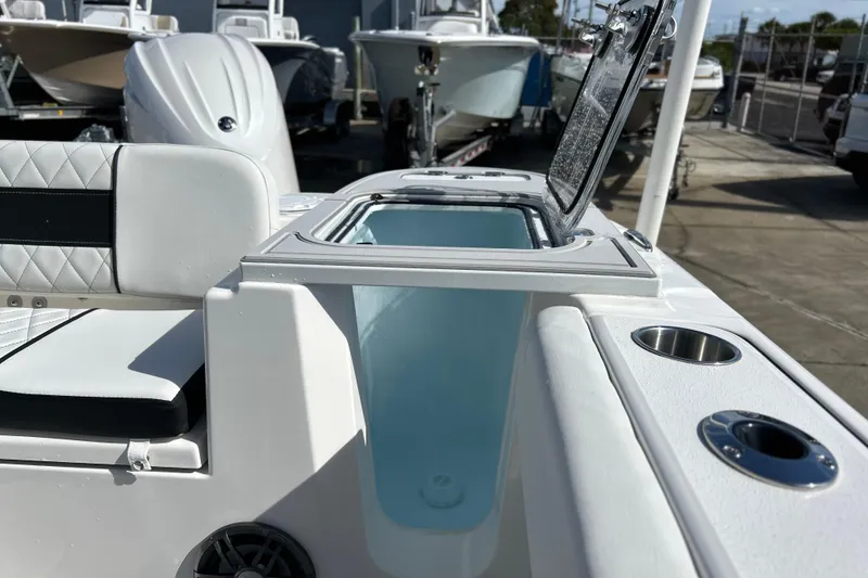Slide: The Image of 2026 Sea Fox 228 Commander boat interior with open storage compartment and seating. - 26