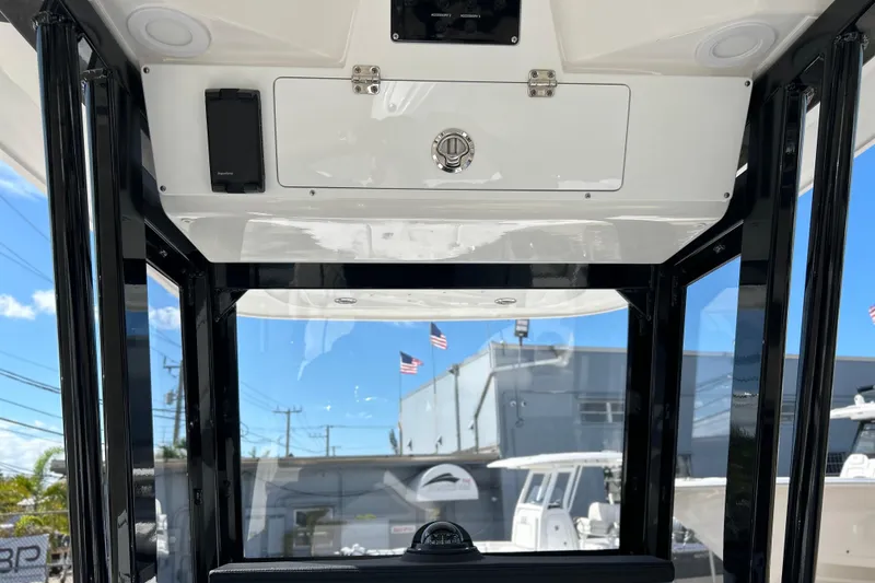 Slide: The Image of 2026 Sea Fox 228 Commander boat interior with storage compartment and sleek design. - 29