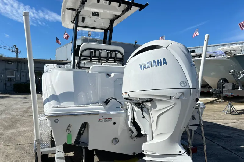 Slide: The Image of 2026 Sea Fox 228 Commander boat with Yamaha engine, displayed outdoors. - 31