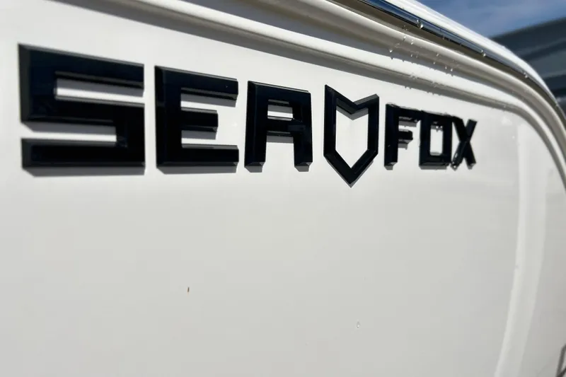 Slide: The Image of Close-up of 2026 Sea Fox 228 Commander logo on boat exterior. - 32