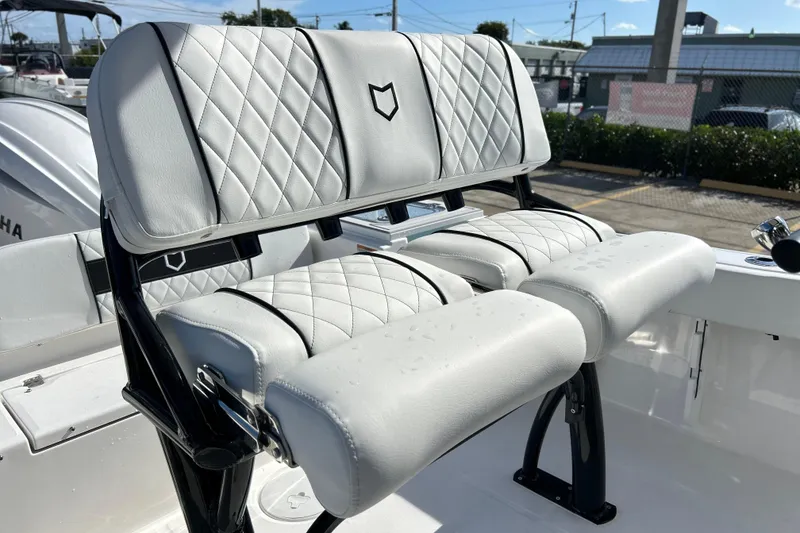 Slide: The Image of 2026 Sea Fox 228 Commander boat with white diamond-stitched seating, showcasing luxury and comfort. - 5