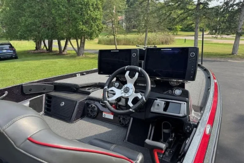 Slide: The Image of Interior of a 2022 Nitro Z21 XL boat with dual monitors and steering wheel. - 3
