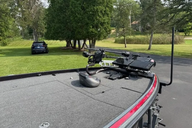 Slide: The Image of 2022 Nitro Z21 XL boat with advanced fishing equipment on a grassy driveway. - 5