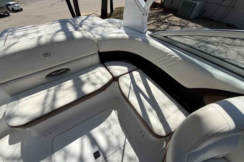 Slide: The Image of Interior of a 2013 Cobalt 232 boat with white leather seating. - 15