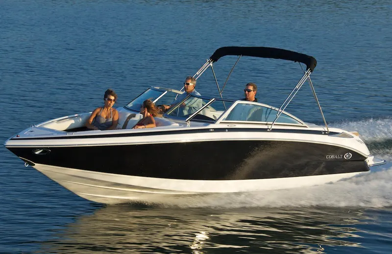 Slide: The Image of Manufacturer Provided Image: 2013 Cobalt 232 boat cruising on water with passengers. - 7