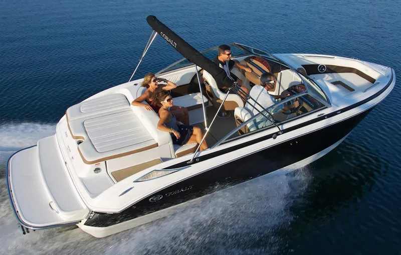 Slide: The Image of Manufacturer Provided Image: 2013 Cobalt 232 boat cruising with passengers on a sunny day. - 8