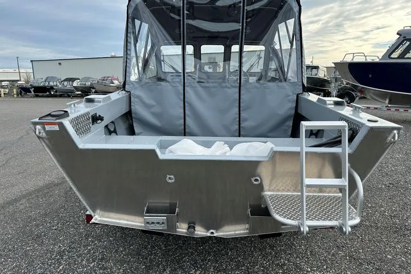 Slide: The Image of 2026 Hewescraft 160 Sportsman boat, rear view with ladder and covered cabin. - 9