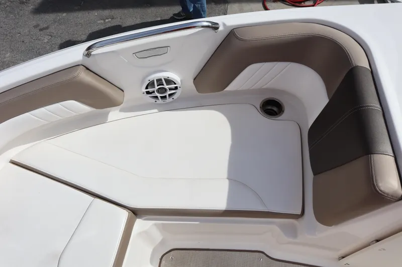 Slide: The Image of 2021 Chaparral 21 SSi boat interior with cushioned seating and speaker. - 12