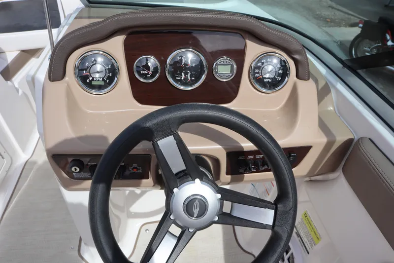 Slide: The Image of Dashboard of 2021 Chaparral 21 SSi boat with steering wheel and gauges. - 19