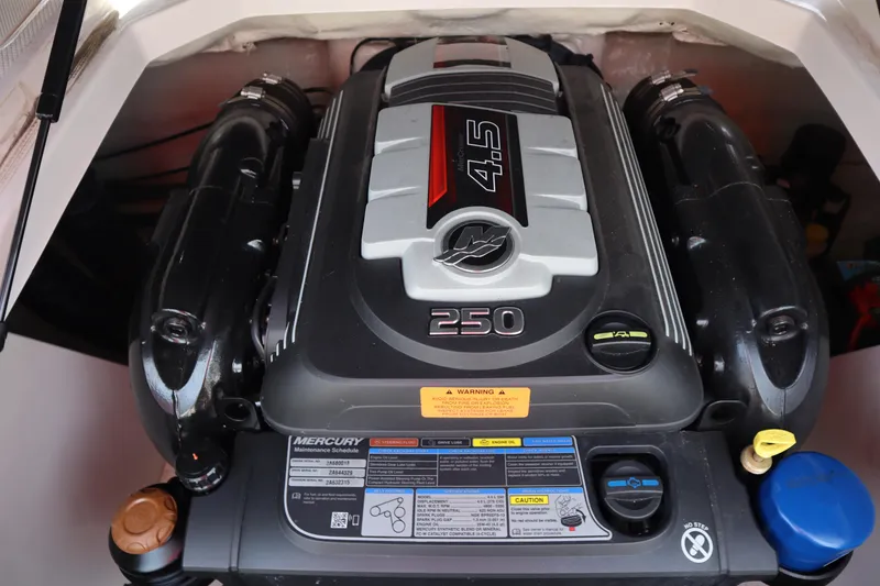 Slide: The Image of Engine of 2021 Chaparral 21 SSi boat, featuring a 4.5L Mercury 250 horsepower motor. - 26