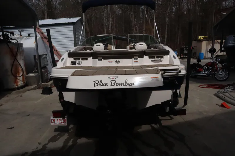 Slide: The Image of 2021 Chaparral 21 SSi boat named "Blue Bomber" parked in a garage. - 3
