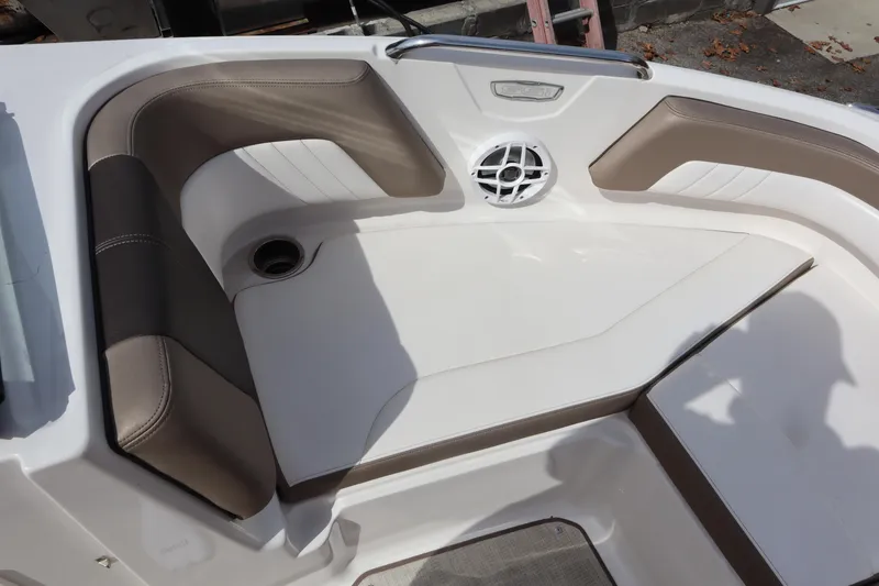 Slide: The Image of 2021 Chaparral 21 SSi boat interior with cushioned seating and speaker. - 7