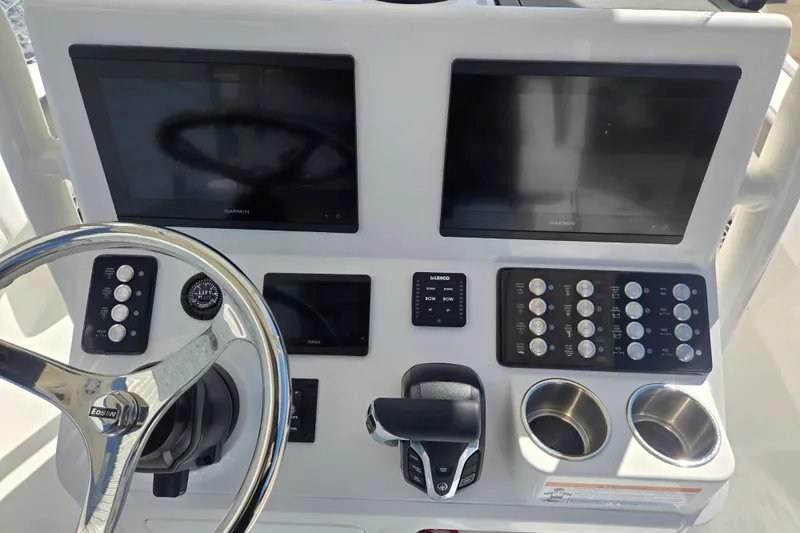 Slide: The Image of Steering console of 2026 Caymas 26 HB boat with dual Garmin displays. - 6