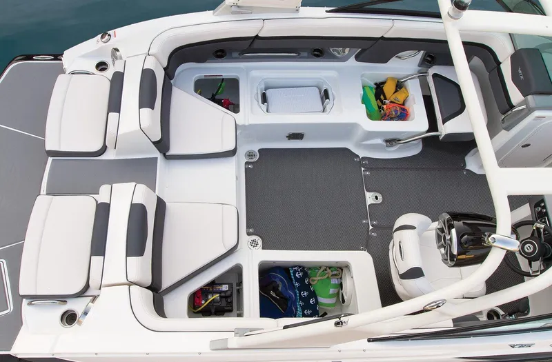 Slide: The Image of Manufacturer Provided Image: 2015 Chaparral Vortex 223 VRX boat interior with seating and storage compartments. - 10