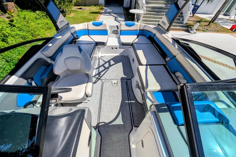 Slide: The Image of 2017 Chaparral Vortex 223 VRX boat interior with blue and white seating. - 13
