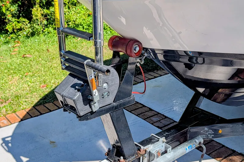 Slide: The Image of Trailer hitch of a 2017 Chaparral Vortex 223 VRX boat on a driveway. - 16