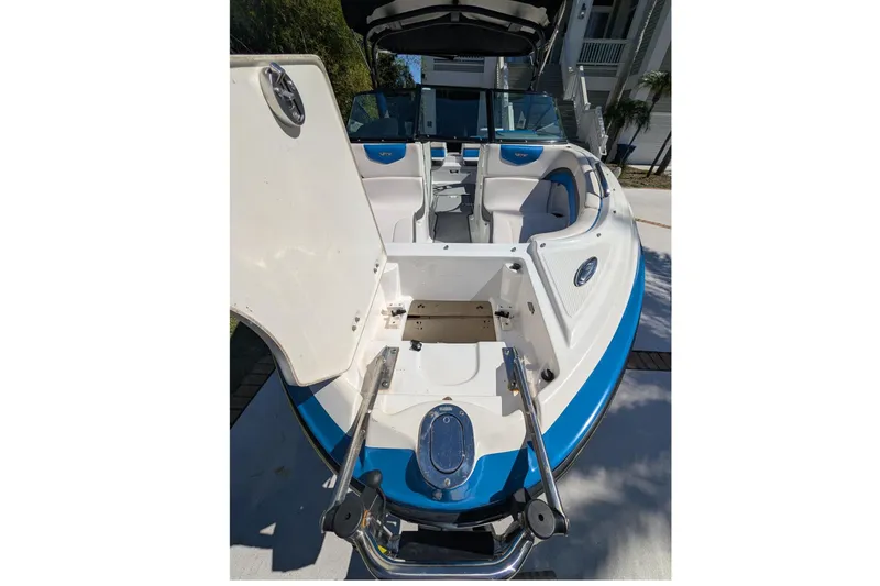 Slide: The Image of 2017 Chaparral Vortex 223 VRX boat interior with open storage compartment and seating. - 6