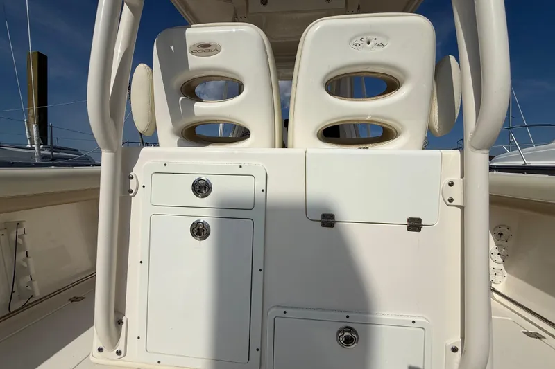 Slide: The Image of 2017 Cobia 296 Center Console boat interior with storage compartments and seating. - 19