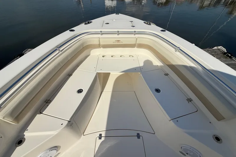 Slide: The Image of 2017 Cobia 296 Center Console boat interior with seating and storage compartments. - 21