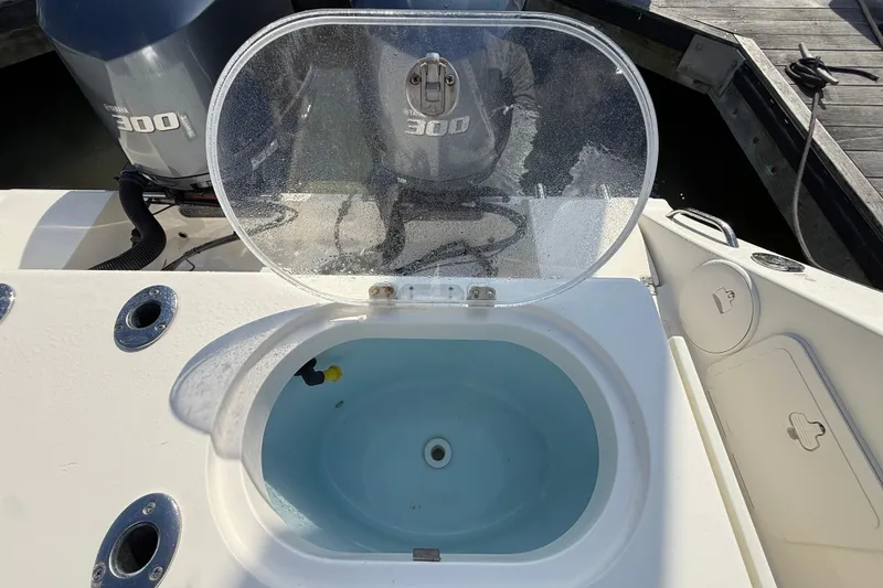 Slide: The Image of Livewell on 2017 Cobia 296 Center Console boat with Yamaha 300 engines. - 30