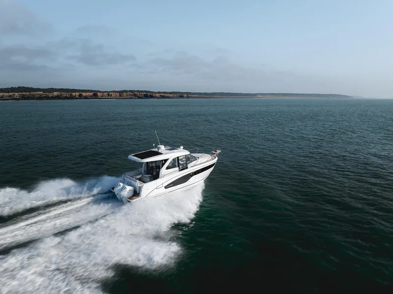 Slide: The Image of 2025 Beneteau Antares 9 cruising on open water, showcasing sleek design and performance. - 8