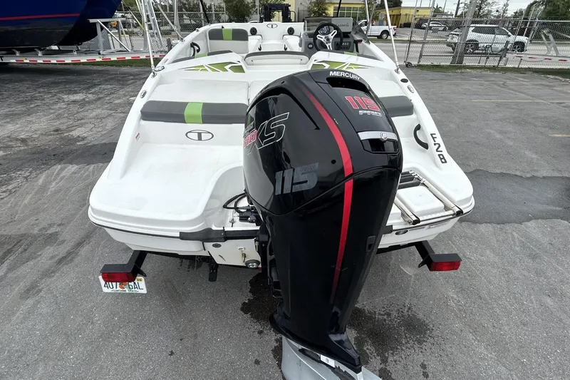 Slide: The Image of 2022 Tahoe T18 boat with Mercury 115 Pro XS outboard motor, parked outdoors. - 35