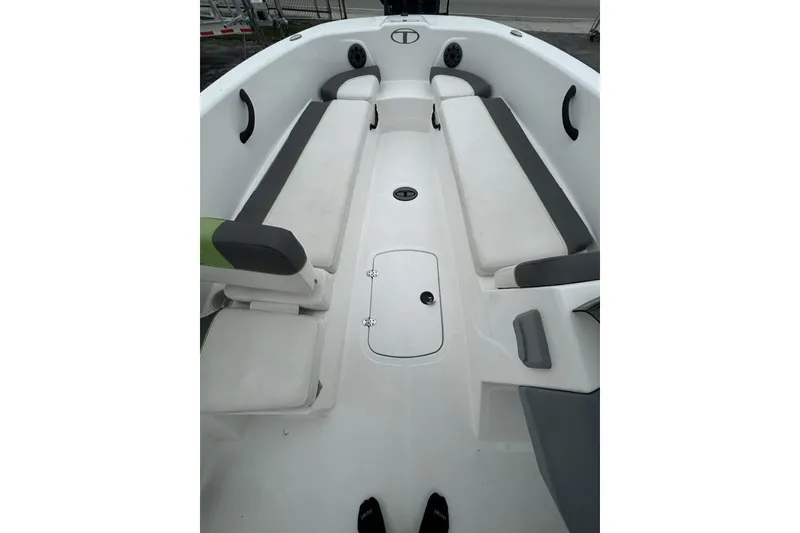 Slide: The Image of 2022 Tahoe T18 boat interior with white and gray seating, spacious layout. - 36