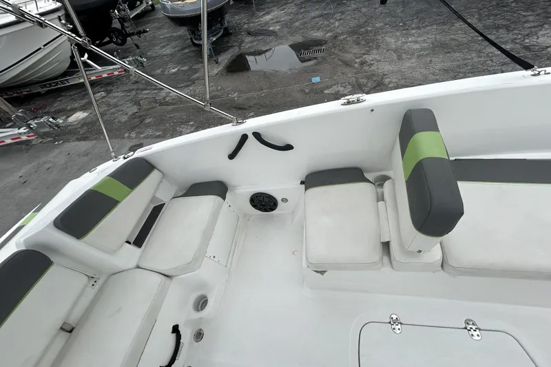 Slide: The Image of Interior of a 2022 Tahoe T18 boat with gray and green seating. - 40