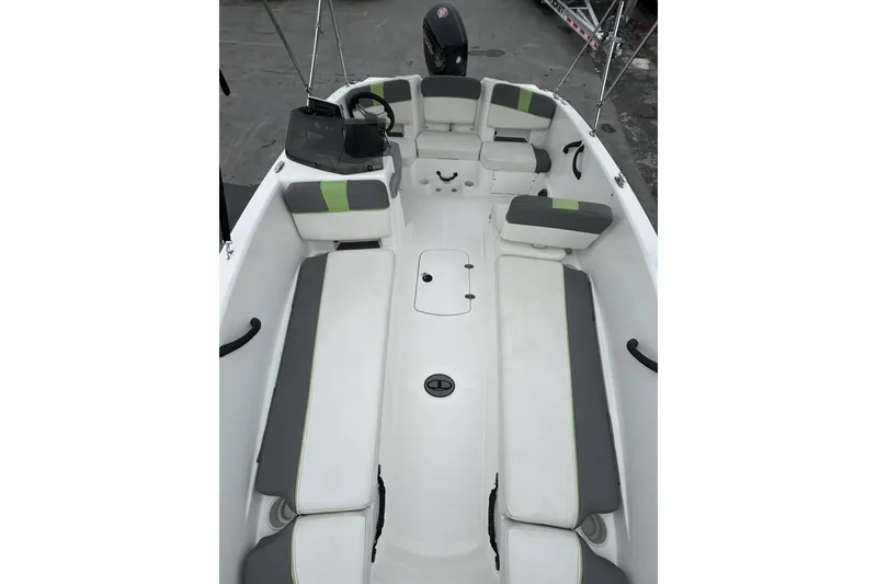 Slide: The Image of 2022 Tahoe T18 boat interior with cushioned seating and steering console. - 41