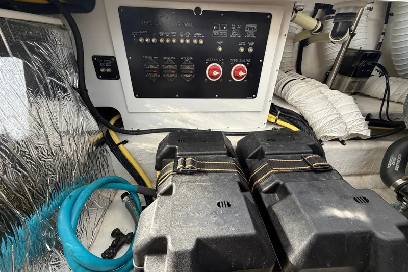Slide: The Image of Engine compartment of 2015 Cruisers Yachts 338 Bow Rider with electrical panel and battery cases. - 25