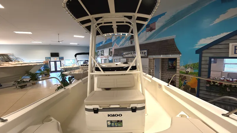 Slide: The Image of Boston Whaler 190 Montauk 2026 in a showroom with nautical murals. - 14