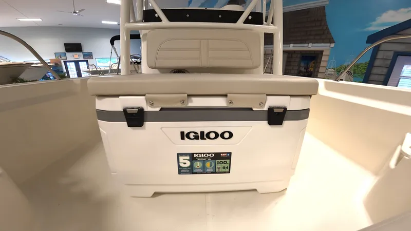 Slide: The Image of Cooler on a boat with white seating and railing. - 16