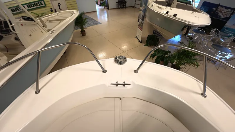 Slide: The Image of Interior view of a Boston Whaler 190 Montauk with a clean, white deck and stainless steel railings. - 18