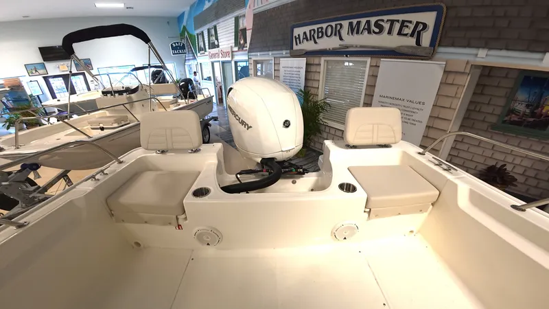 Slide: The Image of Interior view of a Boston Whaler 190 Montauk with engine and seating. - 4