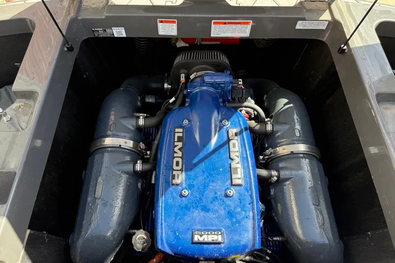 Slide: The Image of 2018 MasterCraft NXT22 Ilmor engine, blue cover, detailed view. - 21