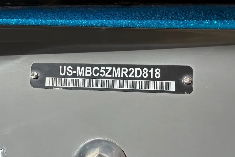 Slide: The Image of 2018 MasterCraft NXT22 boat hull identification number plate. - 22