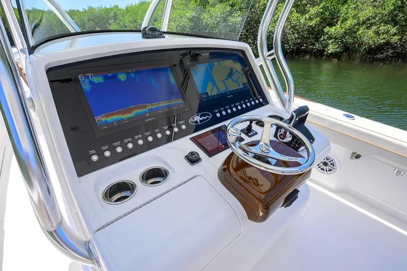 Slide: The Image of 2025 Valhalla V-37 boat dashboard with advanced navigation and control systems. - 12