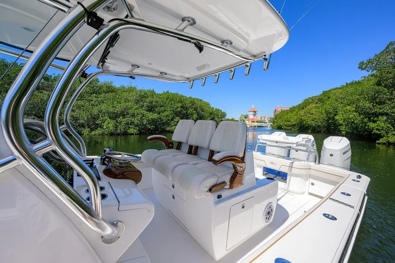 Slide: The Image of 2025 Valhalla V-37 boat interior with luxurious seating and scenic waterway view. - 15