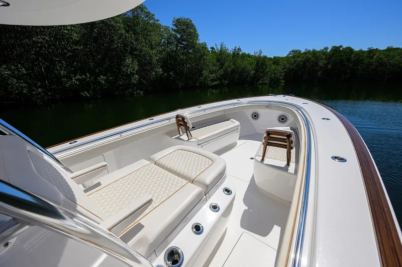 Slide: The Image of Luxurious 2025 Valhalla V-37 boat interior with elegant seating and scenic water view. - 22
