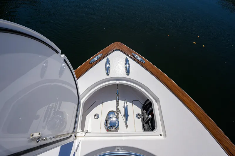 Slide: The Image of Bow of 2025 Valhalla V-37 boat with anchor compartment, on calm water. - 23