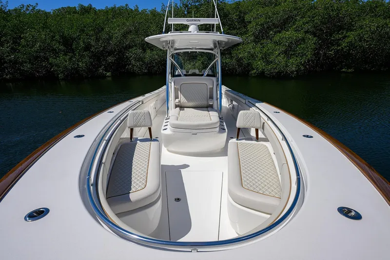 Slide: The Image of 2025 Valhalla V-37 boat with luxurious seating and sleek design on calm water. - 24