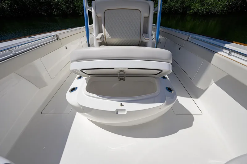 Slide: The Image of 2025 Valhalla V-37 boat interior with open storage compartment and cushioned seating. - 26