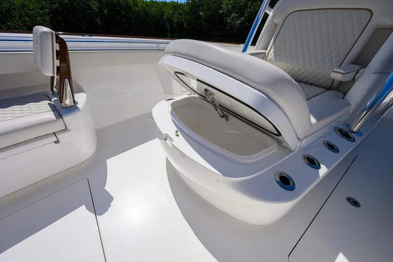 Slide: The Image of 2025 Valhalla V-37 boat interior with open storage compartment and cushioned seating. - 27