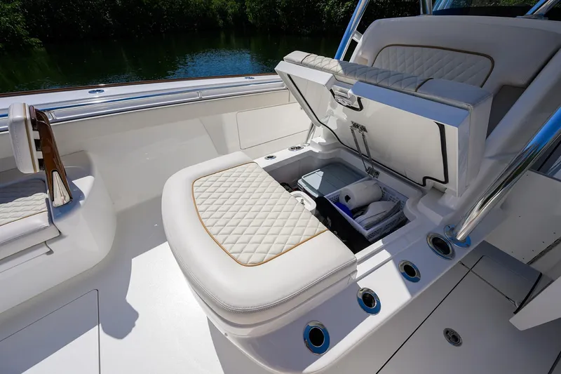 Slide: The Image of 2025 Valhalla V-37 boat interior with open storage compartment and quilted seating. - 28