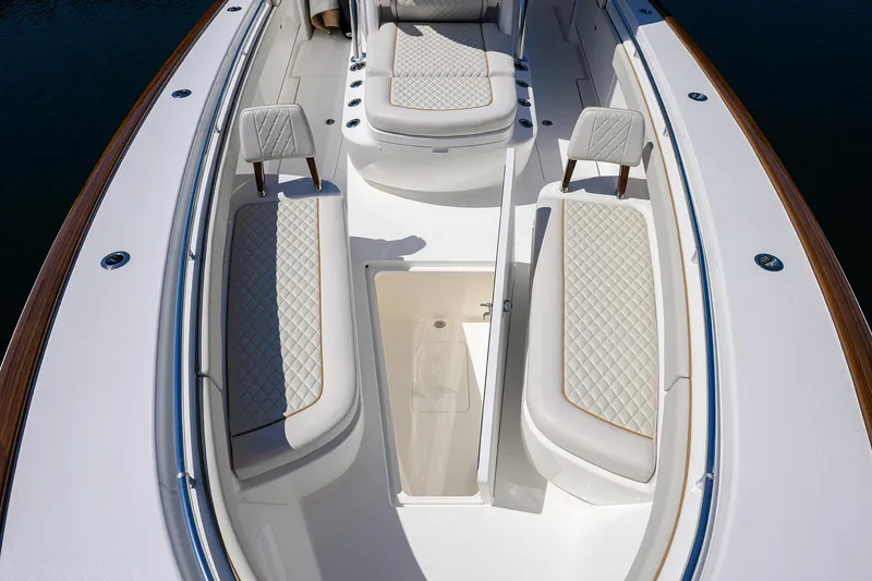 Slide: The Image of Luxurious 2025 Valhalla V-37 boat interior with quilted seating and sleek design. - 29